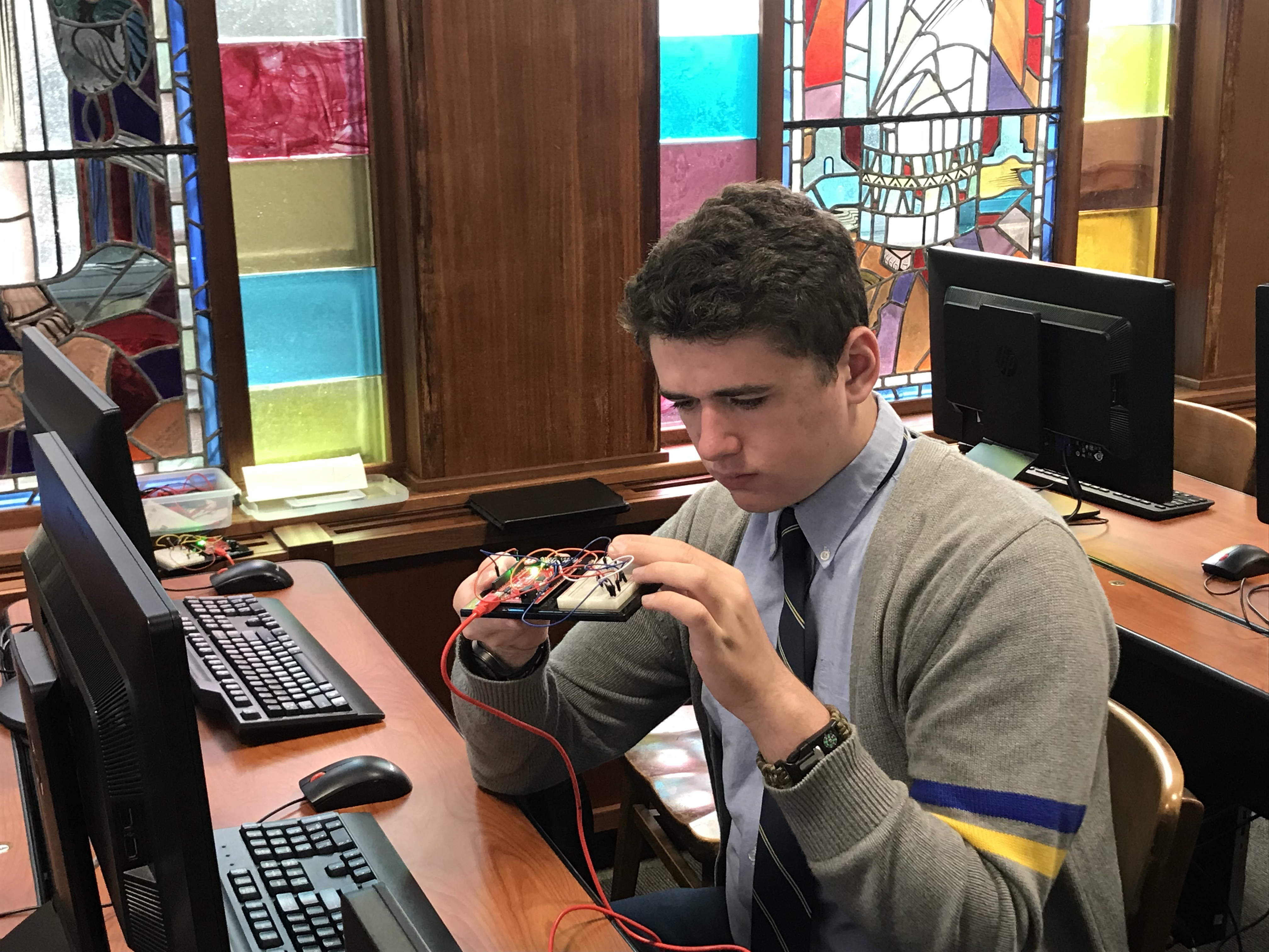 Engineering Students integrating electronics, microprocessors, and coding skills